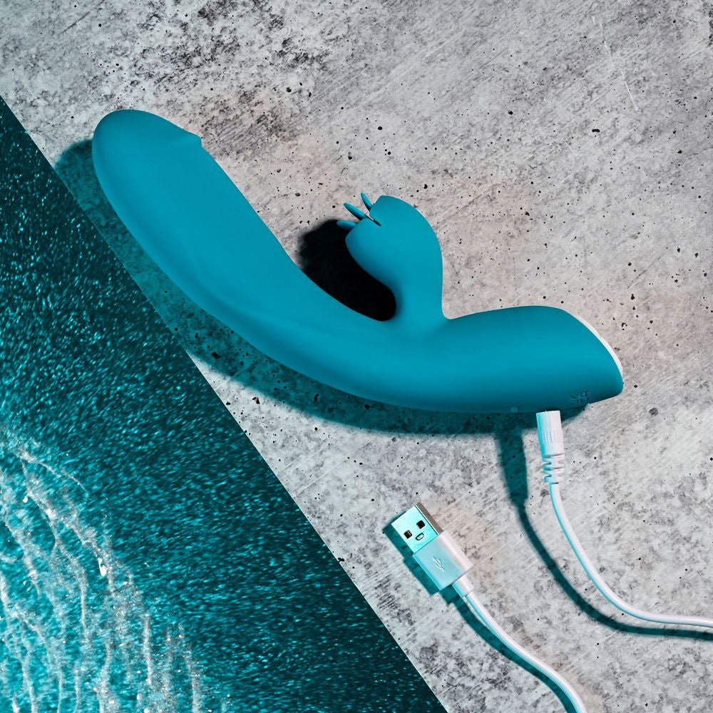 Evolved - fierce flicker - rabbit vibrator - Product top view, focus on charger  | Flirtybay.com.au